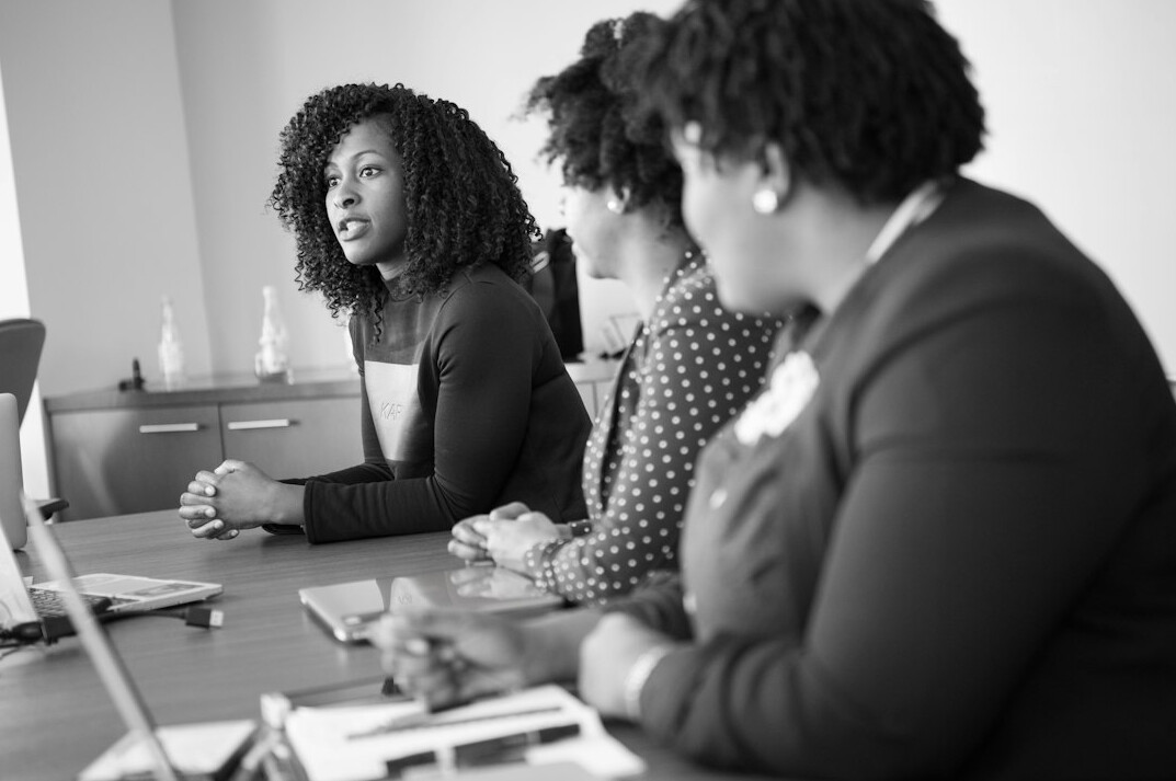 professional woman speaking in meeting