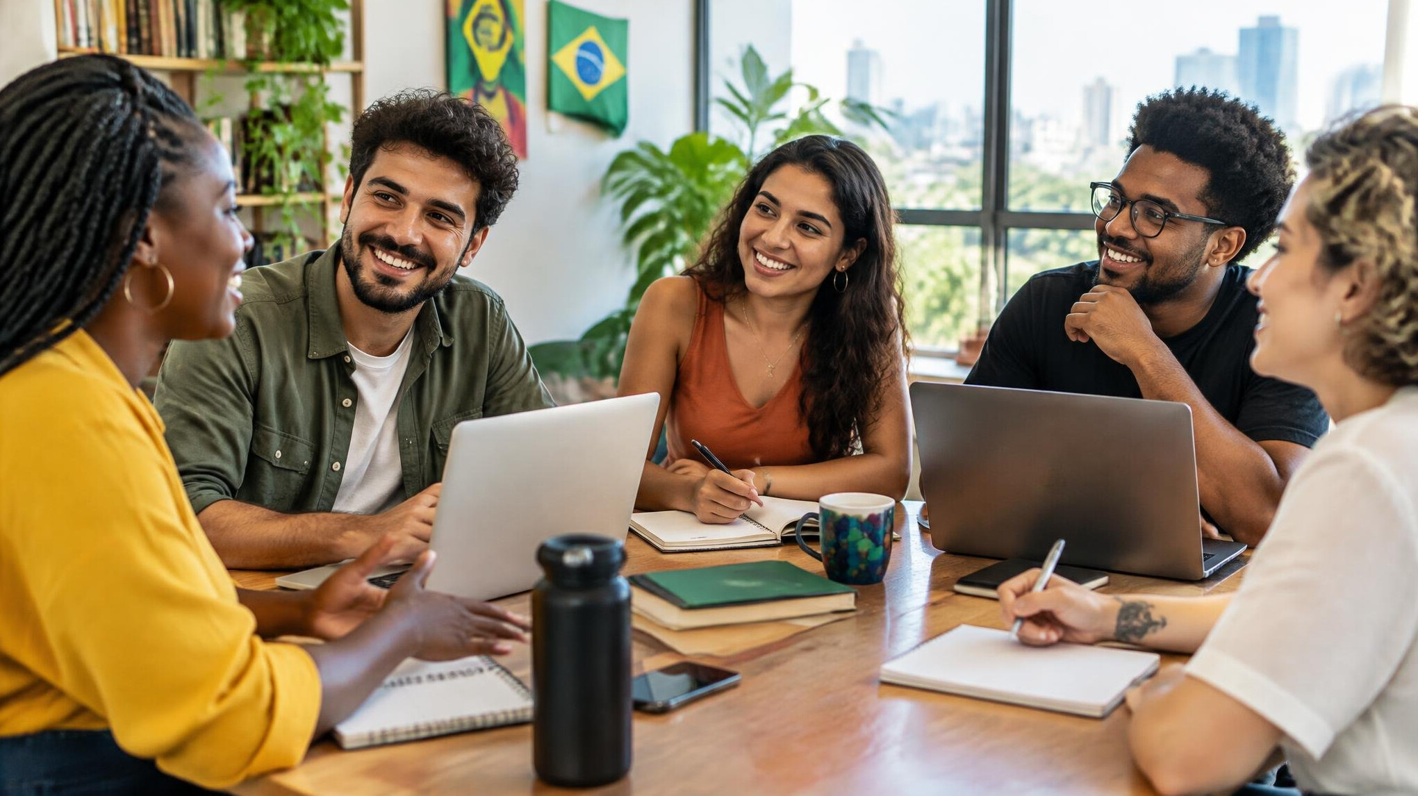 Group of diverse people talking around a table in a bright room